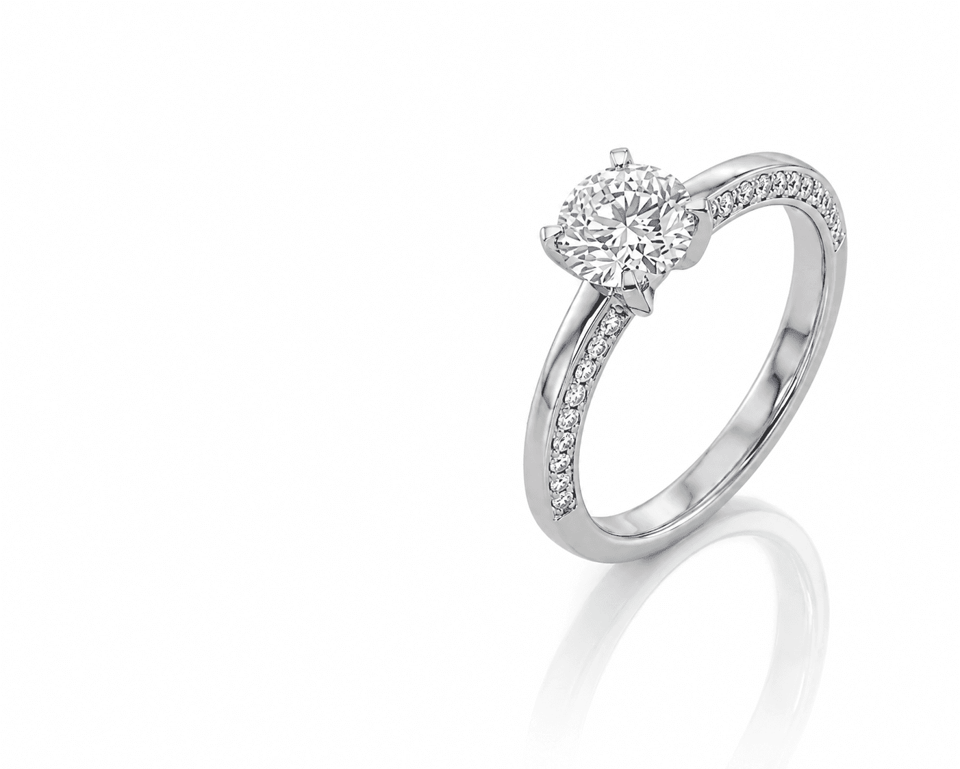 Diamond pavé engagement ring on a soft white surface