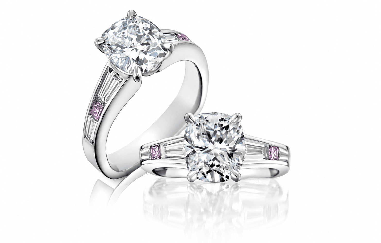 Two diamond engagement rings with pink accent stones